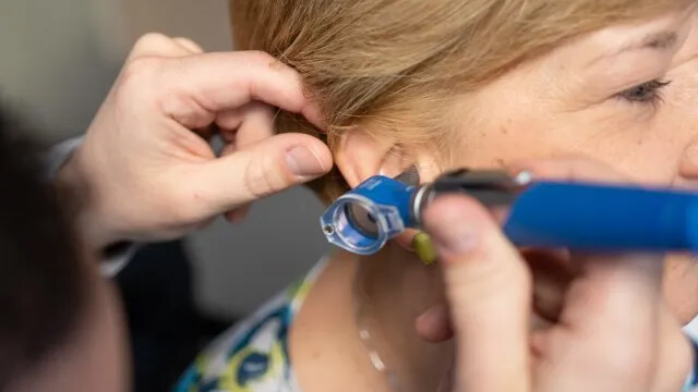 Patient receiving otoscopy